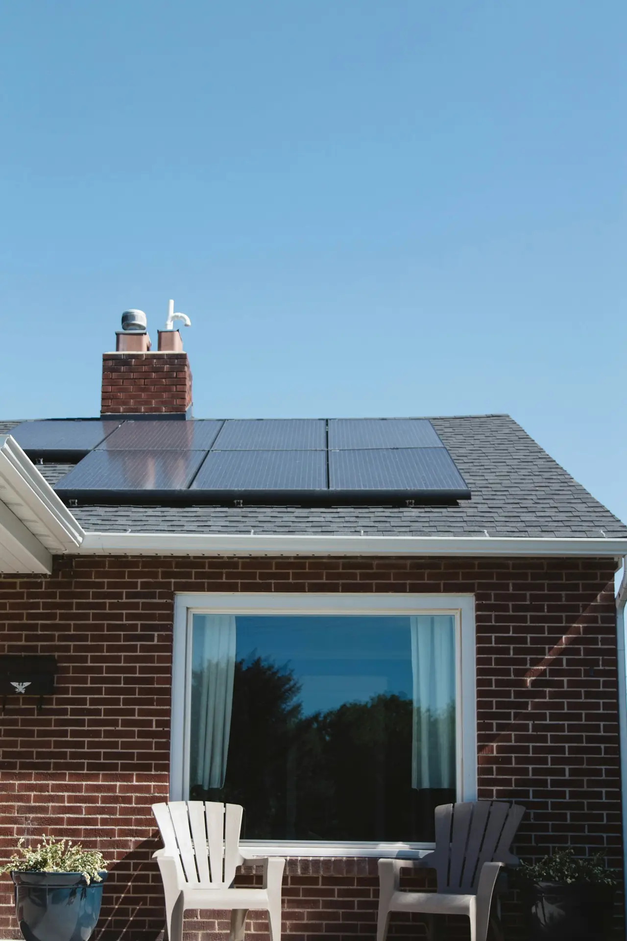 Brick house with a rooftop solar panel system