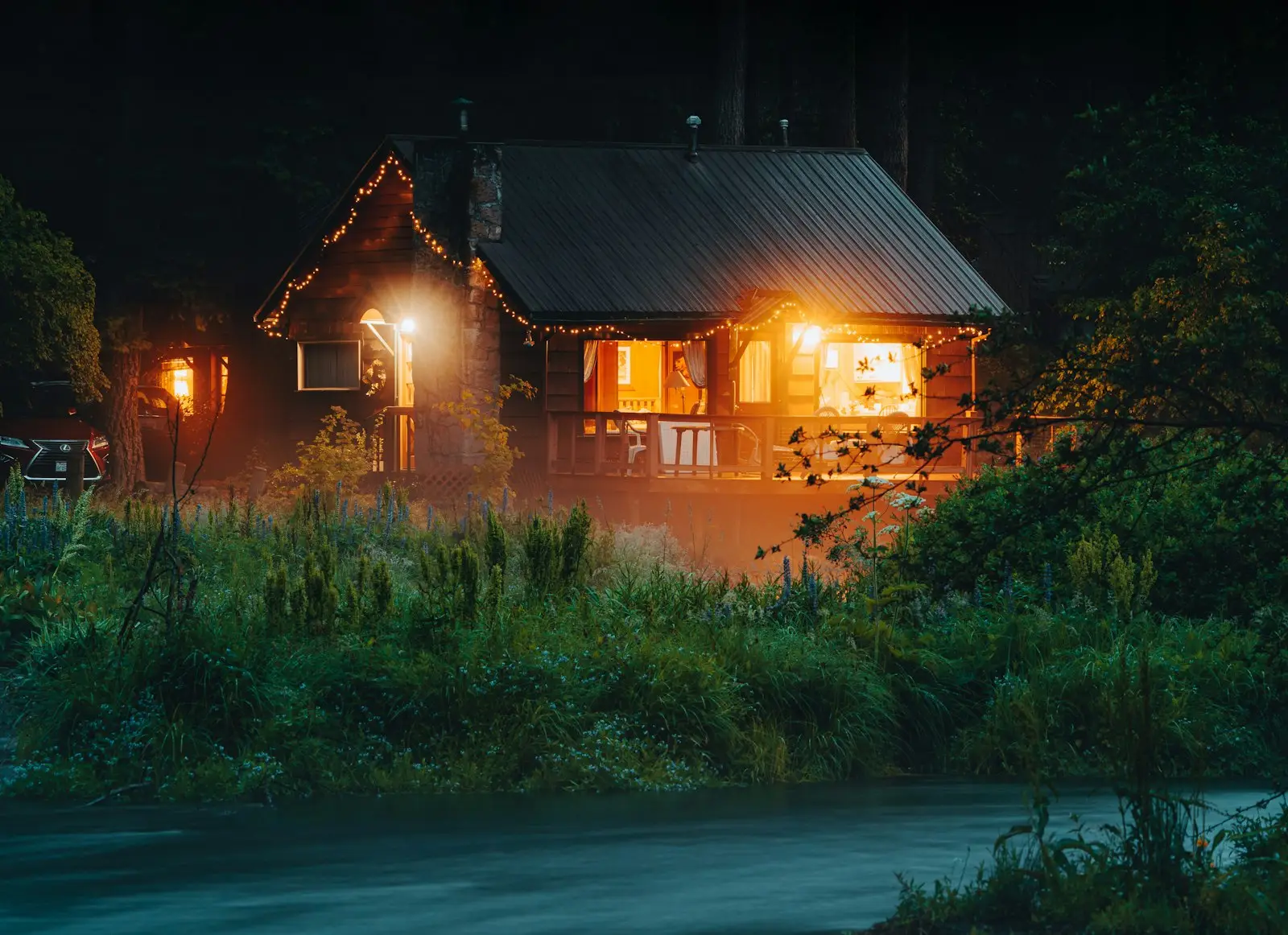 House with lights on at night during load shedding