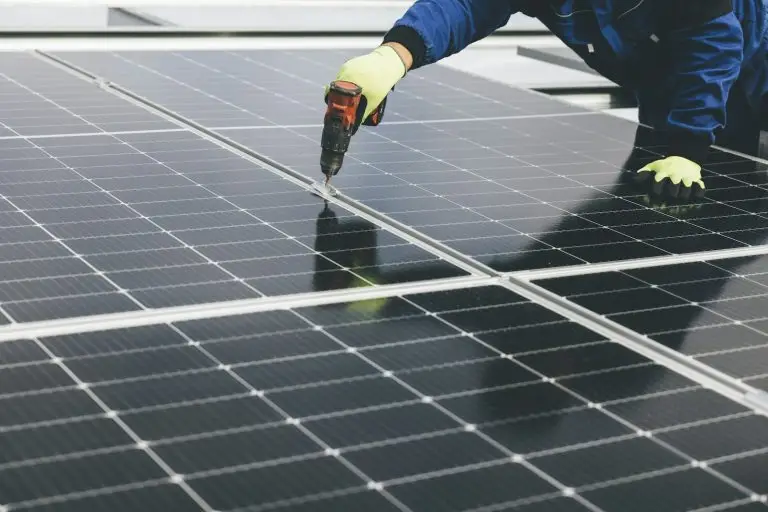 Person working on a solar panel surface