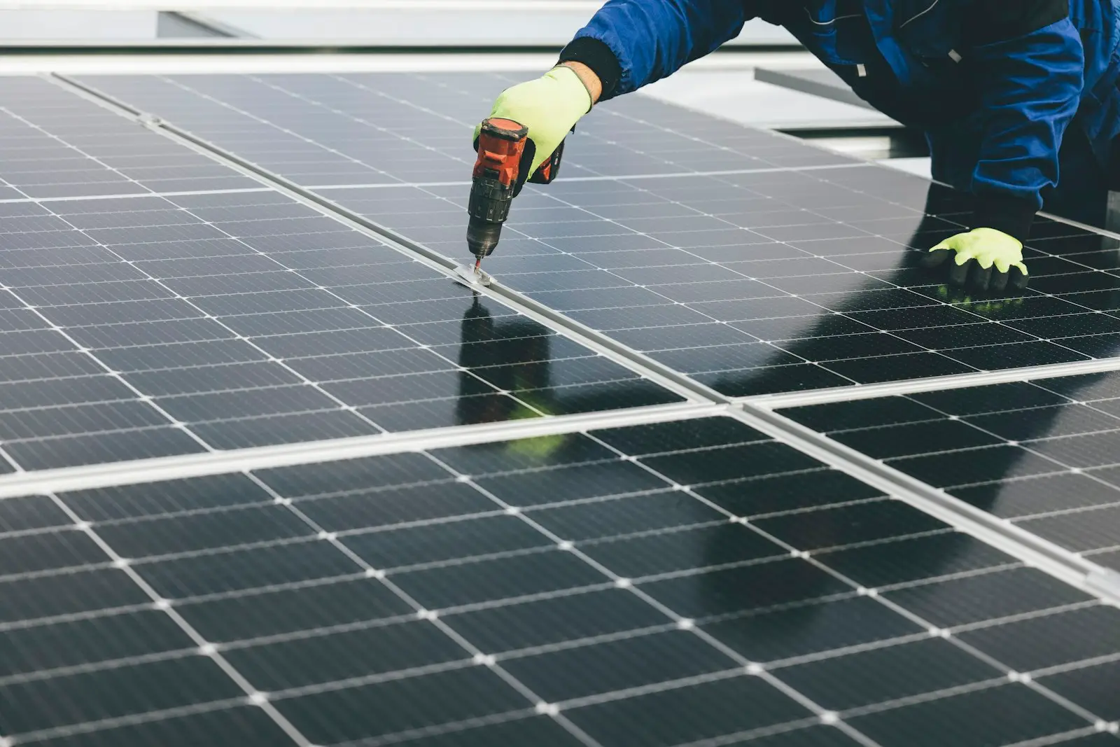 Person working on a solar panel surface