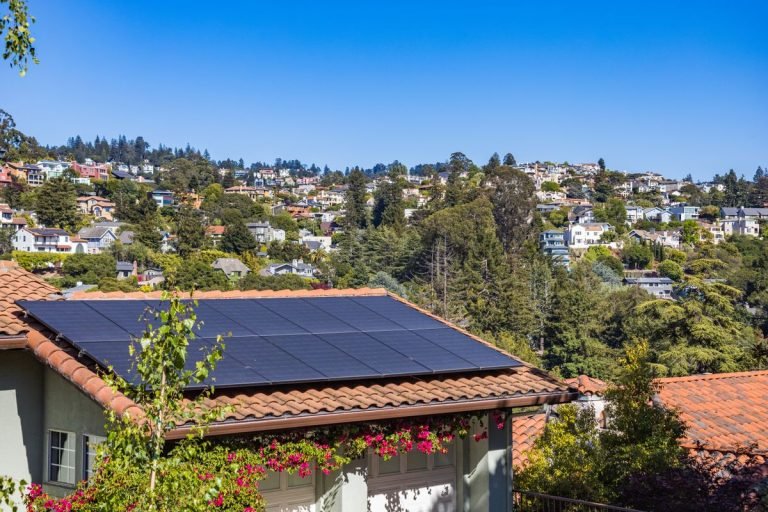 House with solar panels on the roof - three phase solar inverter