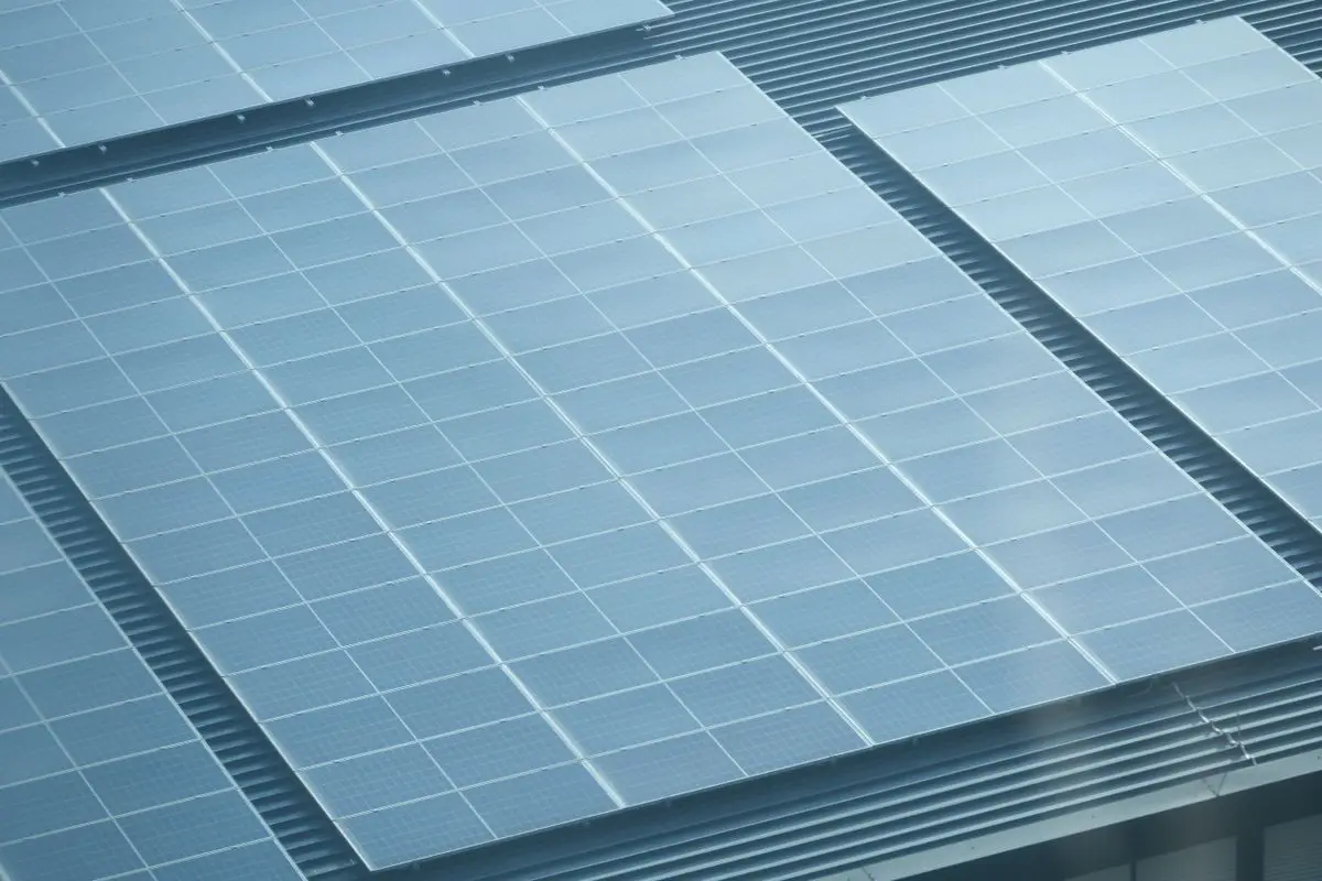 Aerial shot of a roof with solar panels - solar panel output in summer